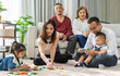 © Art_Photo - Happy asian family spending quality time together at home, parents playing with kids on the floor, grandparents watching and smiling family bonding, love, care, parenting, indoor lifestyle moments