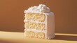 © Napasnan - A slice of vanilla layer cake with fluffy frosting between the layers, presented in a neat, clean cut.