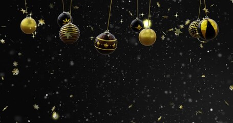 Canvas Print - Swinging black and gold christmas baubles over falling gold stars and snowflakes on black background