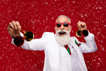 Canvas Print - Photo of funny carefree man dressed white christmas costume glasses dancing holding decorations isolated red color background