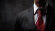 © umar - Elegant businessman in a tailored suit with red tie
