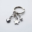 © Mr image - 164. A shiny silver keychain with charms isolated on a simple white background