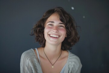 A smiling woman wearing a necklace, a symbol of happiness and joy