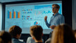 © paco - Business presentation with data charts and confident speaker. A business professional presents data charts and graphs on a screen to a focused audience in a corporate meeting. The image highlights com