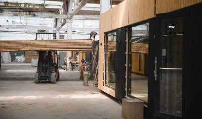 A new wooden modular prefabricated house inside in manufacturing facility