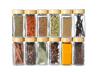 Poster - Different spices in glass jars isolated on white