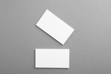 Canvas Print - Blank business cards on grey background, top view. Mockup for design