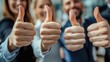 © Charoen - A group of people are giving thumbs up to each other
