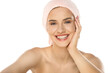 © vladimirfloyd - Beautiful young smiling woman with a towel on the head, posing on the white. Skin, cosmetology