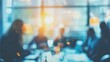 © elimicel - blurred group of diverse professionals engaged in a collaborative meeting. representing teamwork, diversity, and collective brainstorming in a modern business