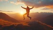 © Ailee Tian - A person jumping for joy on top of the mountain at sunset.