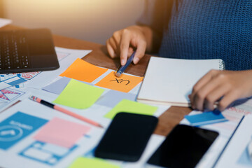 The designer team is designing the uxui system to make the uxui system work well on new phones and support system updates. Website development concept UI UX front end designer