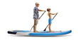 © Ljupco Smokovski - Full length profile shot of a boy and elderly paddling a SUP board together