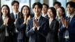 © sungedi - A Group of Business Professionals Clapping in Appreciation