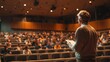 © AdorStudios - scene of a senior lecturer in an auditorium delivering a presentation to an engaged large audience highlighting the teaching event and the interaction between the speaker and the attendees