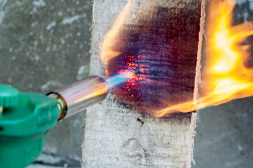 Close-up of gas burner nozzles, wood burning with burner