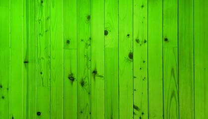 abstract bright green minimal oak wood panel showing beautiful wood grain. wood panel wall runs vertical pattern along. light green wood background.