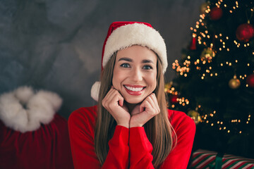 Canvas Print - Photo of lovely cheerful girl dreamy touch cheeks fists dressed red christmas garment tradition atmosphere decor vibe house indoors room