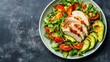 © Nadin Faust - top view grilled chicken with avocado and fresh green salad on dark background, healthy dish concept for balanced diet and clean eating, copy space for advertising or editorial