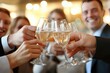 © momostudio - Close-up of people clinking champagne glasses in celebration