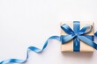 © Nisit - A blue ribbon tied around a gift, symbolizing baby showers or special events, isolated on white background