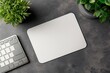 © Avr Di - This is an elegant mousepad mockup with mouse, keyboard, and a potted succulent on a white wooden desk, a modern minimal workspace template.