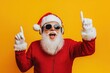 © David Zarzosa - A cool and fun Santa Claus wearing sunglasses and headphones dances on yellow background, christmas and holidays advertising.