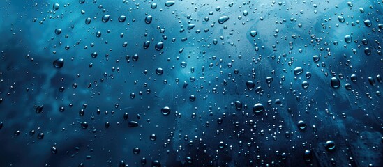 Canvas Print - Close up of water droplets on a dark blue background Abstract sky blue wet texture with bubbles on a glass surface Raindrops realistic clear water droplets condensed for creative banner design