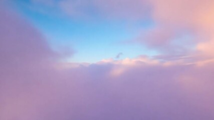 breathtaking mountain valley at sunset, captured by a flying drone, with clouds and warm colors crea