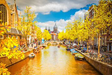 Sticker - Church of St Nicholas, old town canal at fall day, Amsterdam, Netherlands