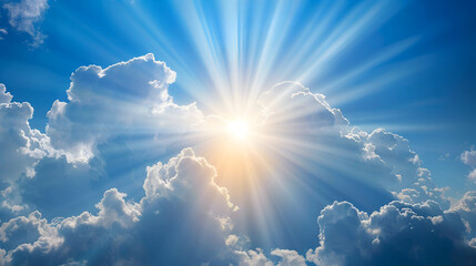 Rays or beams of sunlight emerging from clouds on a clear blue sky. background in spirituality and religion