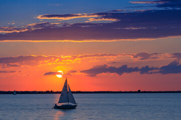 Summer Sunset on Lake Hefner in Oklahoma City, OK, USA, with a sailboat