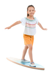 Wall Mural - Little Asian girl with surfboard on white background