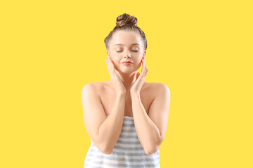 Canvas Print - Young woman after washing hair on yellow background