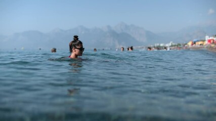 Wall Mural - Enjoying Summer Fun at the Beautiful Beach Swimming and Relaxation for Everyone