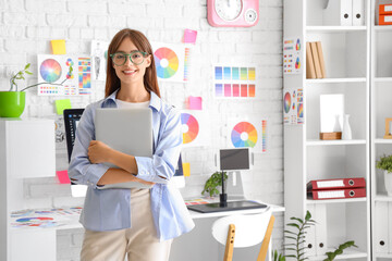 Sticker - Female graphic designer with laptop in office