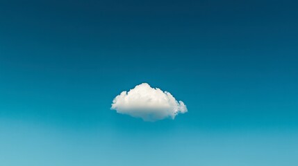 A minimalistic shot of a single cloud against a bright blue sky, isolated and dramatic.