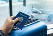 © kieferpix - passport in travelers hand at the airport