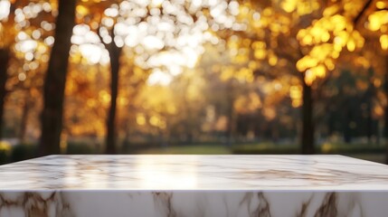 Wall Mural - A blurred background of autumn trees with a marble surface in the foreground.