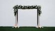© Veerapat - Minimalist-style wedding arch backdrop with clean lines and modern elegance