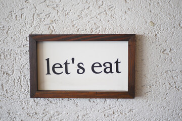 Charming and Inviting Lets Eat Wall Decor Perfect for Creating Warm Dining Spaces Atmosphere