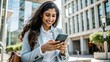 © nilawan - Young Businesswoman using Smartphone in City.