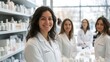 © Kanyakarn - Cheerful female professionals in white lab coats at a modern pharmacy, showcasing a variety of skincare products.