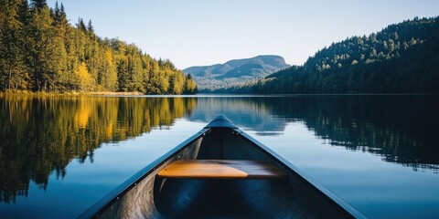 Wall Mural - A canoe gliding across a peaceful lake 