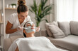 © dK - A relaxing spa facial treatment where a professional esthetician applies a rejuvenating face mask to a client, promoting skincare and self-care in a calm, serene environment