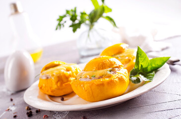 Veggie stuffed round cougretes on white plate