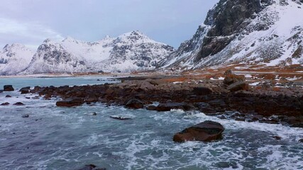 Wall Mural - 4k drone flight moving to the side footage (ultra high definition) of sunset on lofoten islands. ama