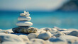 A Stack of White Stones with a Flower on Top, Resting on a Bed of Pebbles by the Sea