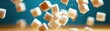 © narak0rn - Dynamic image of sugar cubes falling, capturing the essence of sweetness and culinary delight in a captivating scene.
