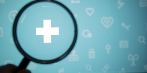 Magnifying glass focusing on medical cross symbol